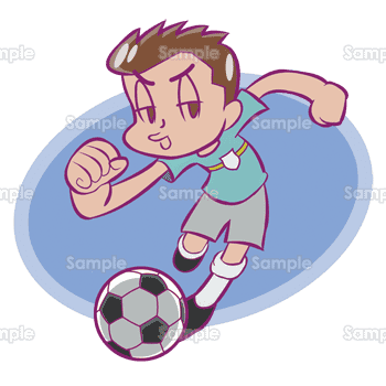 ドリブルをするサッカー少年